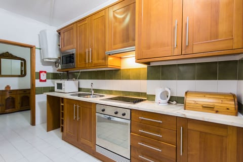 Family Apartment, 3 Bedrooms | Private kitchen | Full-size fridge, microwave, electric kettle, cookware/dishes/utensils