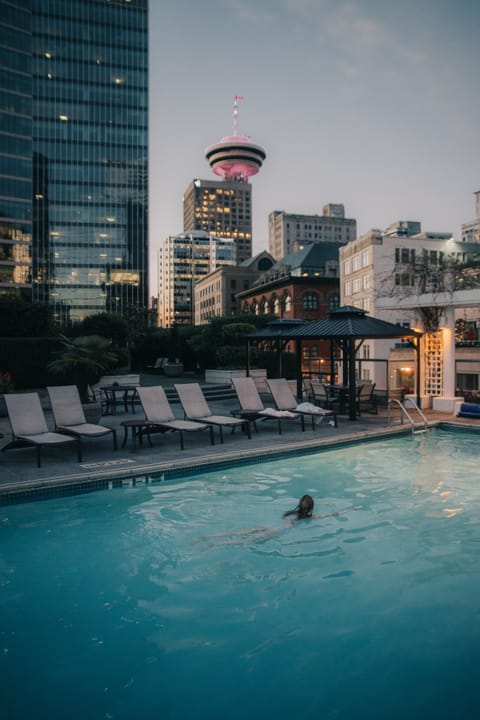 Outdoor pool, a heated pool, pool umbrellas, sun loungers