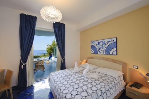 Deluxe Double Room, Terrace, Sea View | Premium bedding, minibar, in-room safe, desk