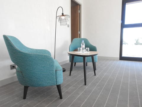 Luxury Studio | Living area | Flat-screen TV