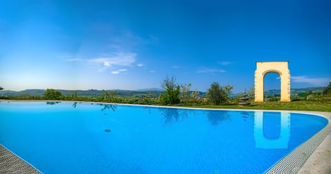 Outdoor pool, a rooftop pool, pool umbrellas, sun loungers