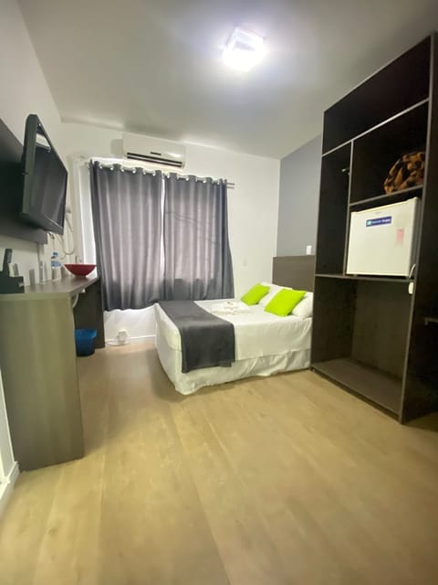 Economy Room, 1 Bedroom | Minibar, blackout drapes, iron/ironing board, free WiFi