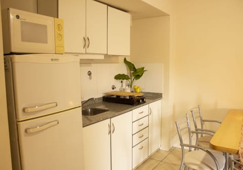 Family Apartment, 2 Bedrooms | Private kitchen | Fridge, microwave, stovetop, coffee/tea maker