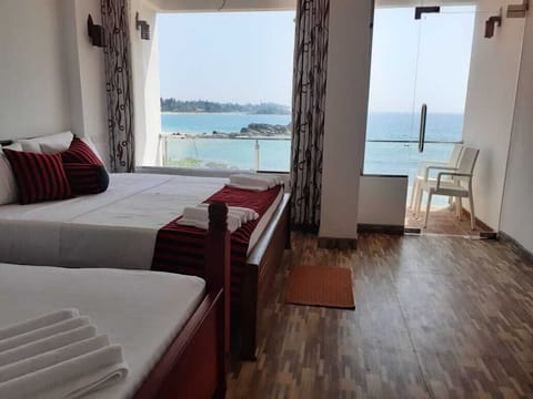 Superior Triple Room, 1 Bedroom, Sea View, Beachfront | Premium bedding, desk, laptop workspace