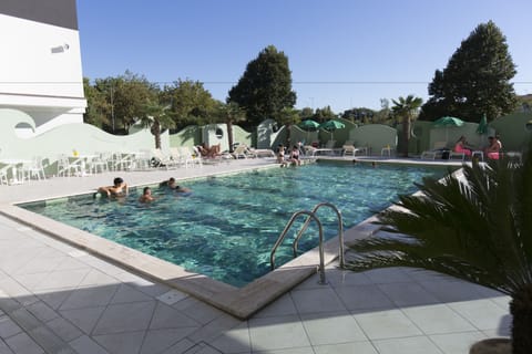 Outdoor pool, open 9:00 AM to 10:00 PM, pool umbrellas, sun loungers