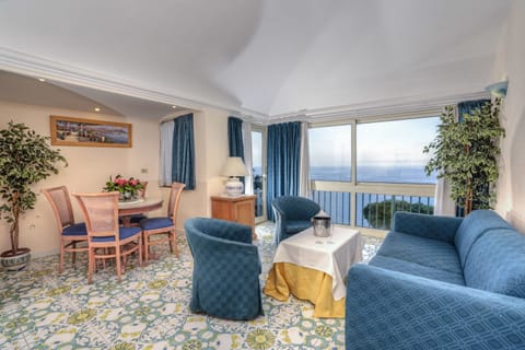 Junior Suite, Balcony, Sea View | Minibar, in-room safe, desk, blackout drapes