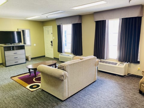 Suite, 1 King Bed | In-room safe, desk, iron/ironing board, free cribs/infant beds