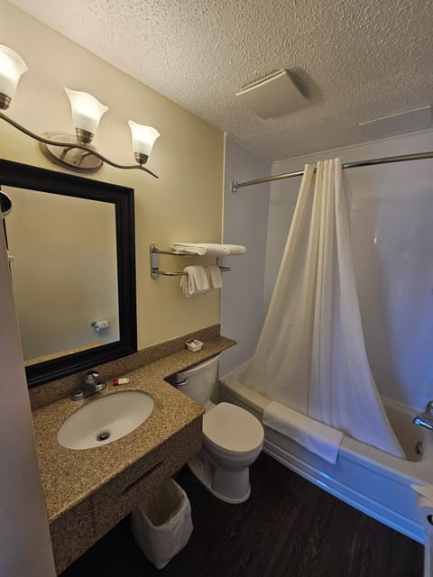 Standard Room, 2 Queen Beds | Bathroom | Combined shower/tub, free toiletries, hair dryer, towels