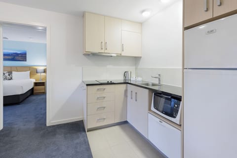 Suite, 1 King Bed, Non Smoking | Private kitchen | Fridge, microwave, electric kettle, cookware/dishes/utensils