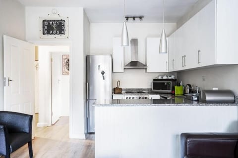 Family Apartment, Multiple Beds | Private kitchen | Full-size fridge, microwave, oven, stovetop