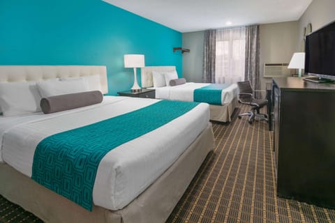 Standard Room, 2 Queen Beds | In-room safe, desk, laptop workspace, blackout drapes