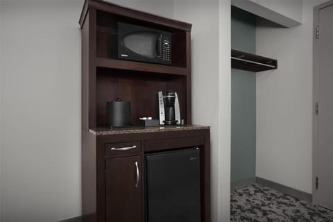 Premium bedding, desk, laptop workspace, blackout drapes