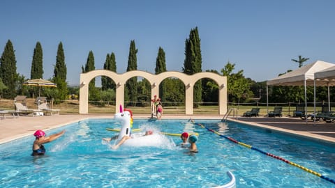 Seasonal outdoor pool, open 9:30 AM to 7:30 PM, pool umbrellas