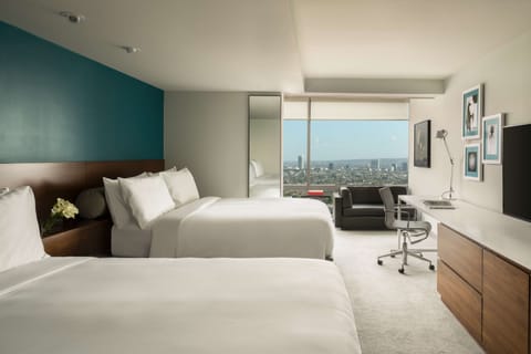 Premium bedding, down comforters, free minibar items, in-room safe