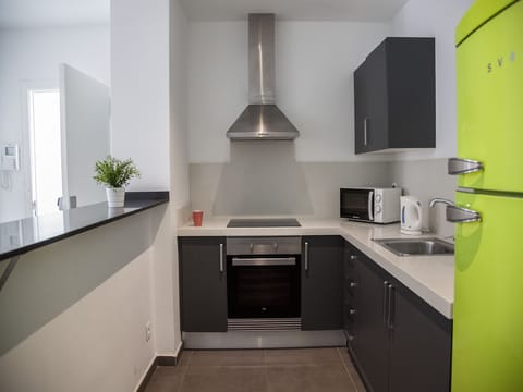 Apartment, 3 Bedrooms, Balcony | Private kitchen | Full-size fridge, microwave, oven, stovetop