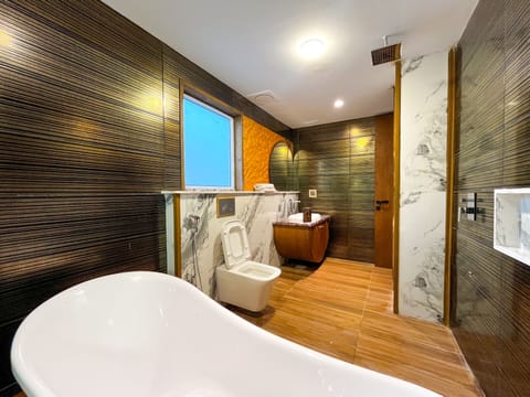 Signature Room | Bathroom | Separate tub and shower, jetted tub, rainfall showerhead