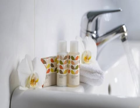 Designer toiletries, hair dryer, towels