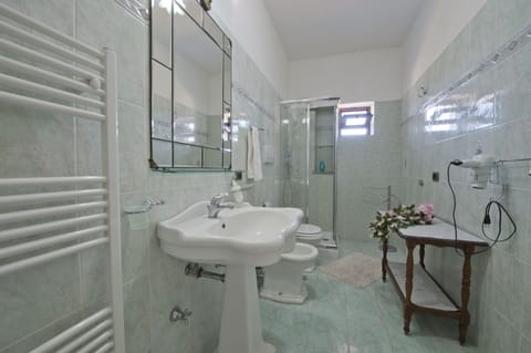 Classic Quadruple Room, Multiple Beds, Sea View | Bathroom | Shower, free toiletries, hair dryer, bathrobes