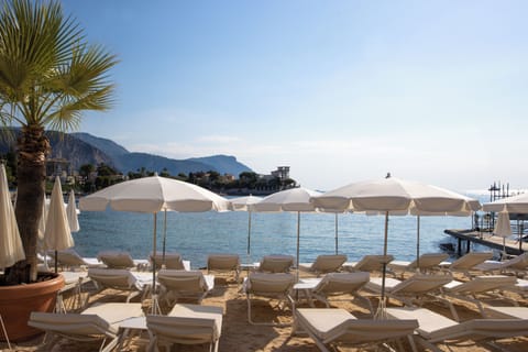 On the beach, sun loungers, beach umbrellas, beach towels