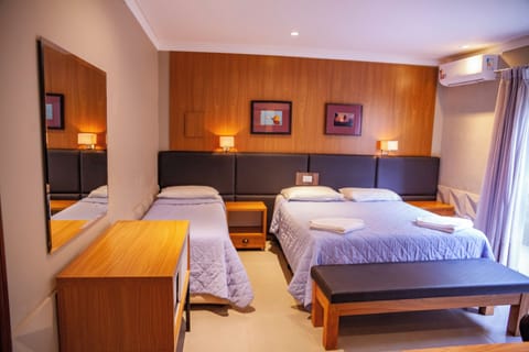 Deluxe Triple Room | Minibar, in-room safe, desk, free WiFi