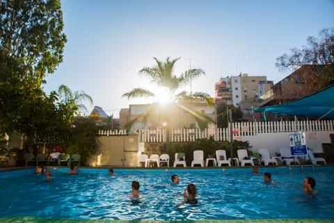 Seasonal outdoor pool, pool umbrellas, sun loungers