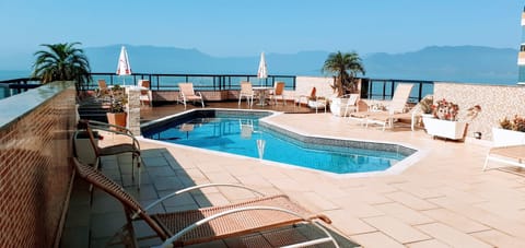 Outdoor pool, open 8:30 AM to 9:30 PM, pool umbrellas, sun loungers