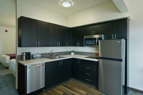 Extended Stay Balcony 2 Queen Suite Kitchenette | Private kitchen | Fridge, microwave, coffee/tea maker