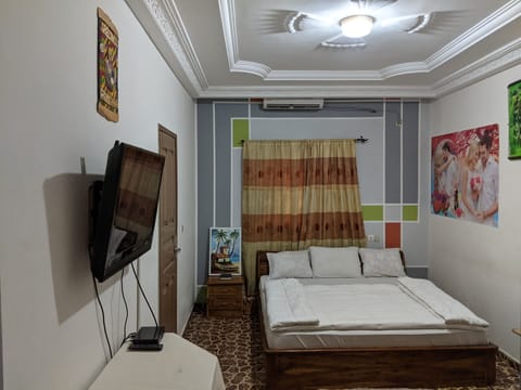 Luxury Triple Room, 1 King Bed | Living area | 42-inch flat-screen TV with satellite channels, TV