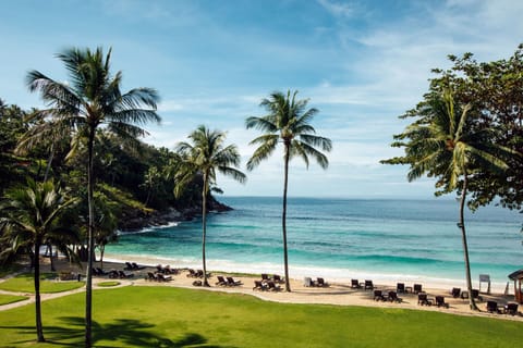 On the beach, white sand, beach umbrellas, beach towels