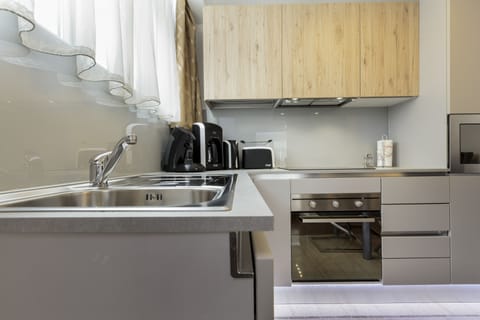 Executive Apartment, 1 Bedroom | Private kitchen | Full-size fridge, microwave, oven, stovetop