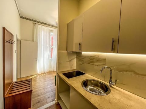 Deluxe Condo | Private kitchen | Mini-fridge, stovetop, coffee grinder, cookware/dishes/utensils