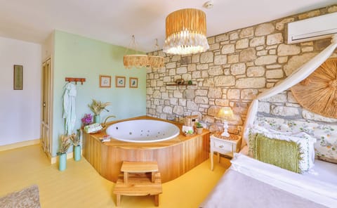 Deluxe Room with Terrace, Fireplace and Jetted Tub | Egyptian cotton sheets, premium bedding, minibar, in-room safe