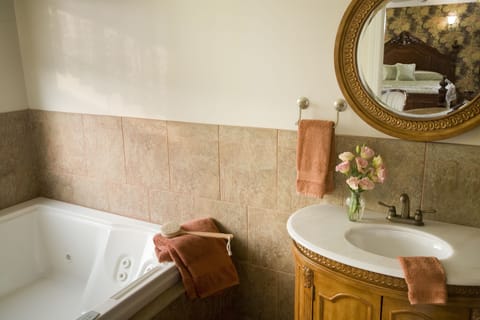 Suite, 1 King Bed (Jacuzzi and Fireplace) | Bathroom | Shower, free toiletries, hair dryer, towels