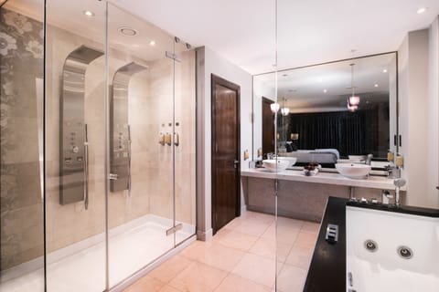 Suite X11 | Bathroom | Combined shower/tub, designer toiletries, hair dryer, bathrobes