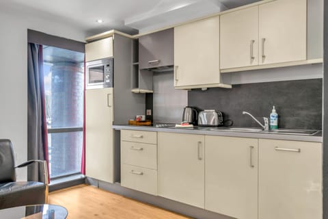 Twin Grande Studio | Private kitchen | Full-size fridge, microwave, stovetop, dishwasher