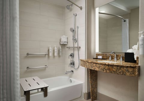 Combined shower/tub, designer toiletries, hair dryer, towels