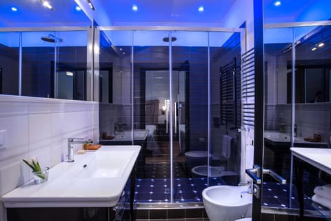 Suite, City View | Bathroom | Shower, eco-friendly toiletries, hair dryer, slippers