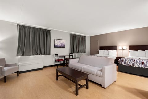 Suite, 2 Queen Beds, Non Smoking, Kitchenette | In-room safe, desk, laptop workspace, blackout drapes