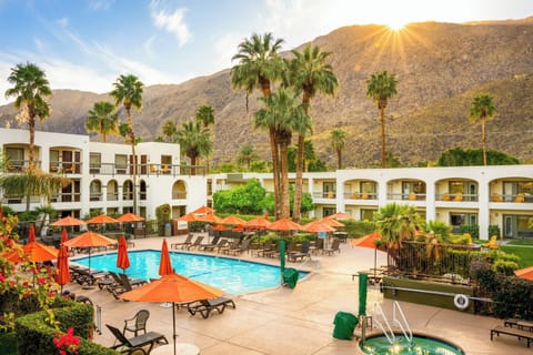 Outdoor pool, a heated pool, open 8:00 AM to 10:00 PM, pool umbrellas