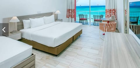 Standard Double Room, 1 Bedroom, Beach View | Free minibar, in-room safe, desk, blackout drapes