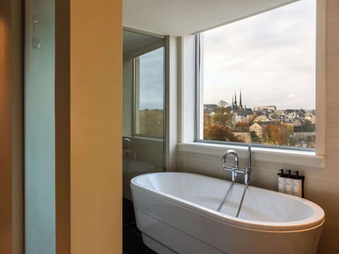 Suite, 1 King Bed | Bathroom | Shower, designer toiletries, hair dryer, bathrobes