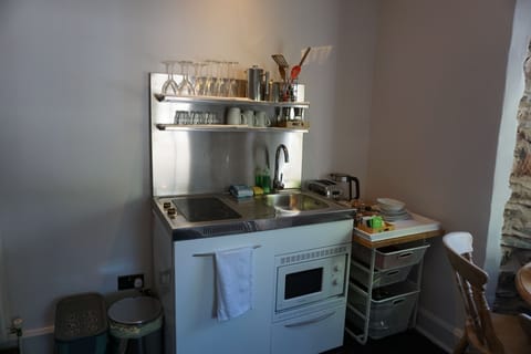 Riverside Apartment | Private kitchenette | Coffee/tea maker, electric kettle