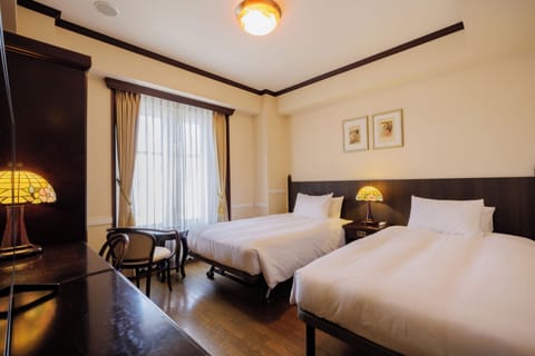 Economy Twin Room, Non Smoking | Minibar, in-room safe, desk, free WiFi