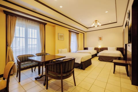 Family Room - Non-Smoking | Minibar, in-room safe, desk, free WiFi