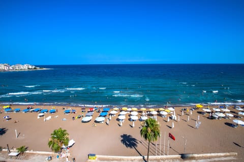 On the beach, sun loungers, beach umbrellas