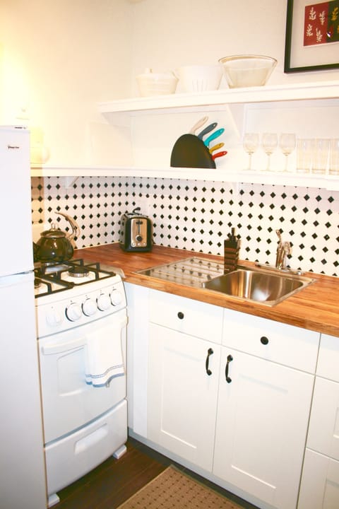 Deluxe Studio Suite, 1 King Bed, Kitchen, Ground Floor | Private kitchen | Microwave, coffee/tea maker, electric kettle, toaster