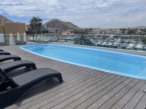 Outdoor pool, open 9:00 AM to 8:00 PM, sun loungers