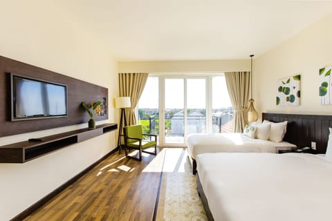 Deluxe Triple Room, Balcony (City/Rice Field View) | Minibar, in-room safe, desk, laptop workspace