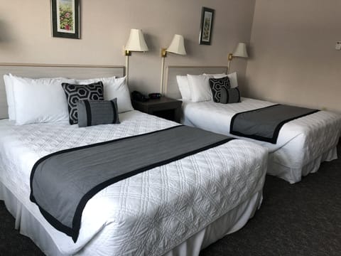 Standard Room, 2 Queen Beds | Individually decorated, desk, blackout drapes, free WiFi