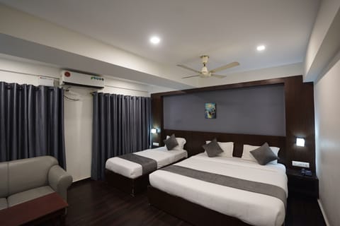 Deluxe Triple Room (with AC) | Premium bedding, in-room safe, desk, rollaway beds